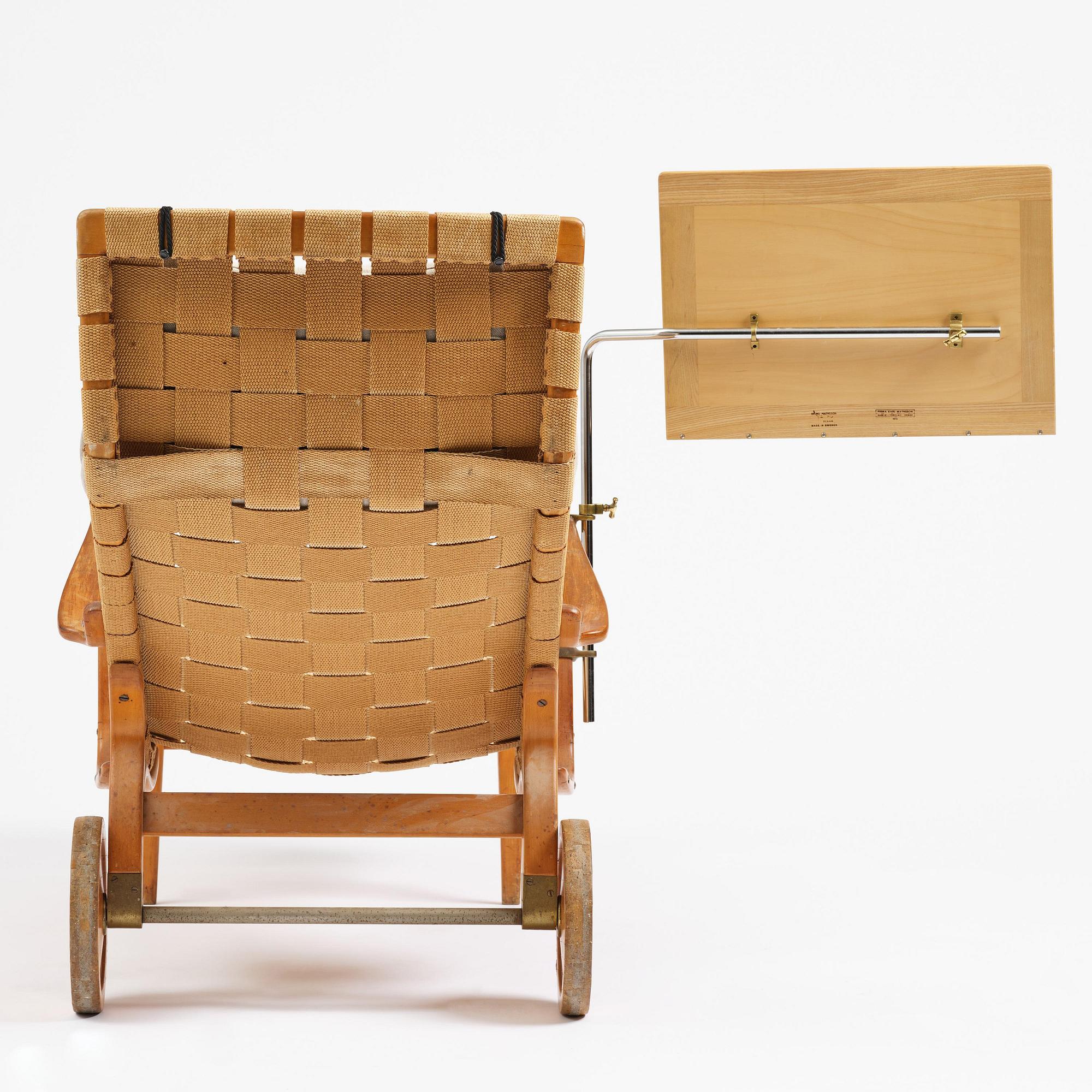 Bruno Mathsson, a lounge chair with wheels, Firma Karl Mathsson, Värnamo, 1940s, with reading table from 1972.