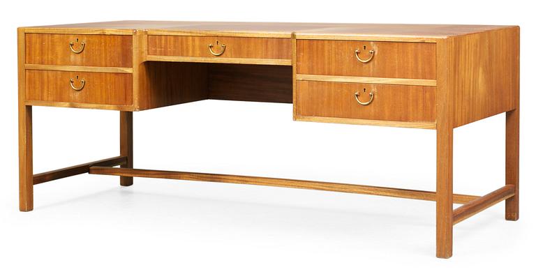 A Josef Frank mahogany desk by Svensk Tenn, the front with five drawers, the back with a bookshelf.
