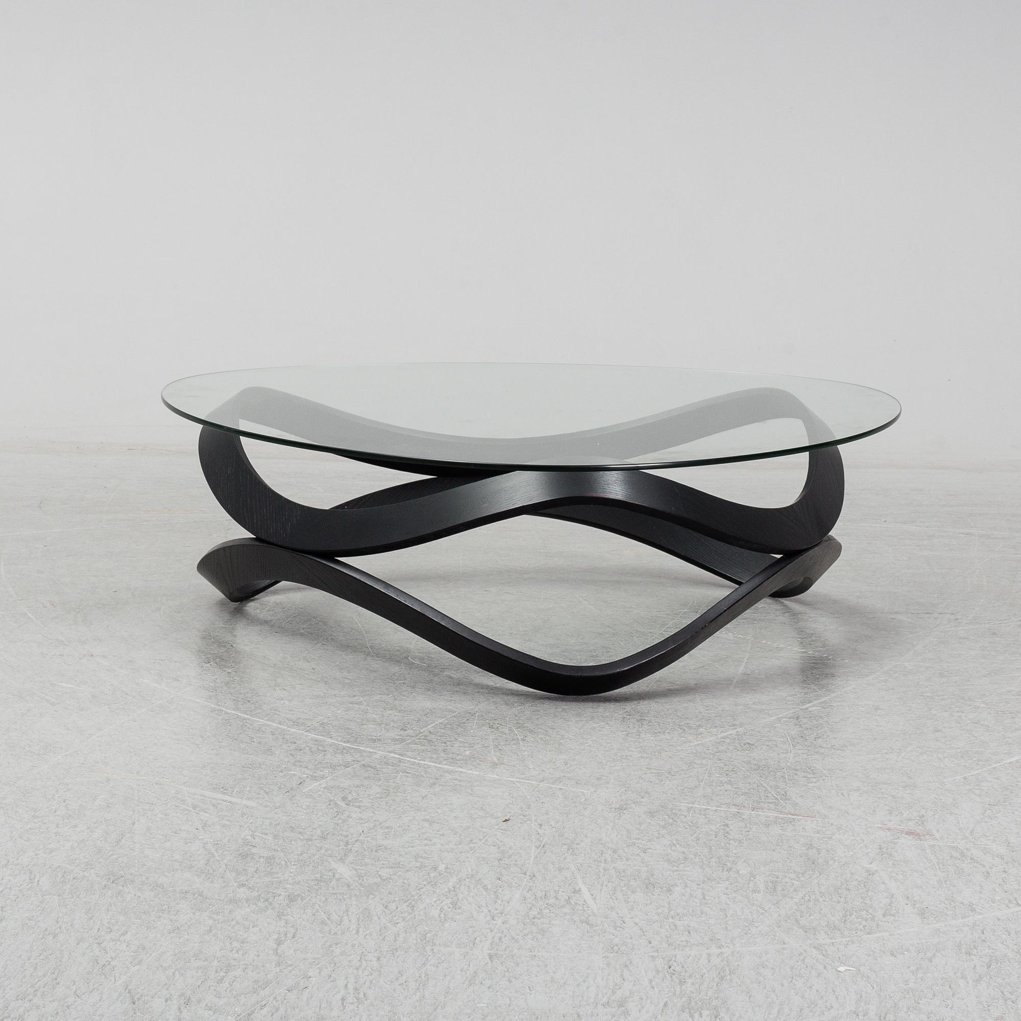 a "Newton" coffee table designed by Dan Sunaga & Staffan Holm in 2009.