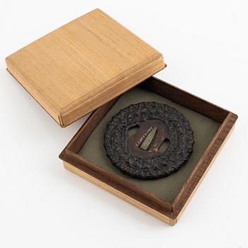 A copper-iron tsuba, Edo (1603-1868), 18th century, in a kiri box.