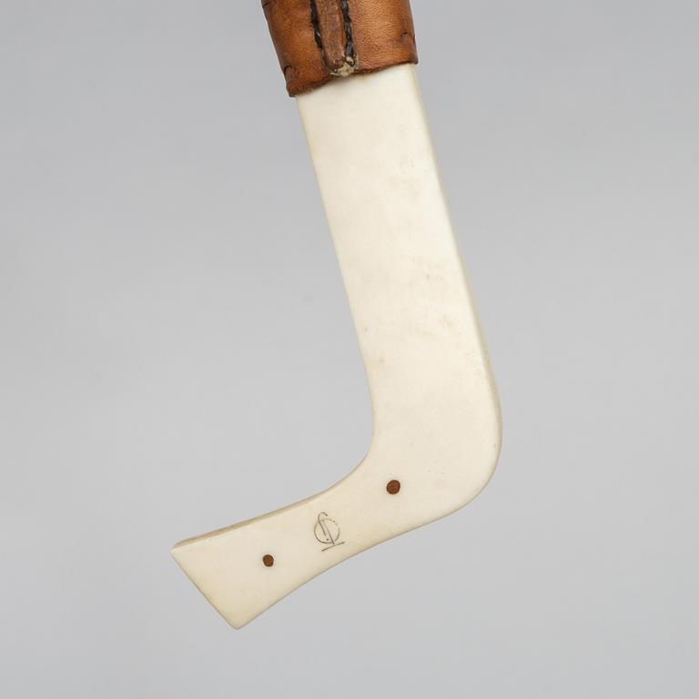 Oskar Tjäder, A reindeer horn knife, signed.
