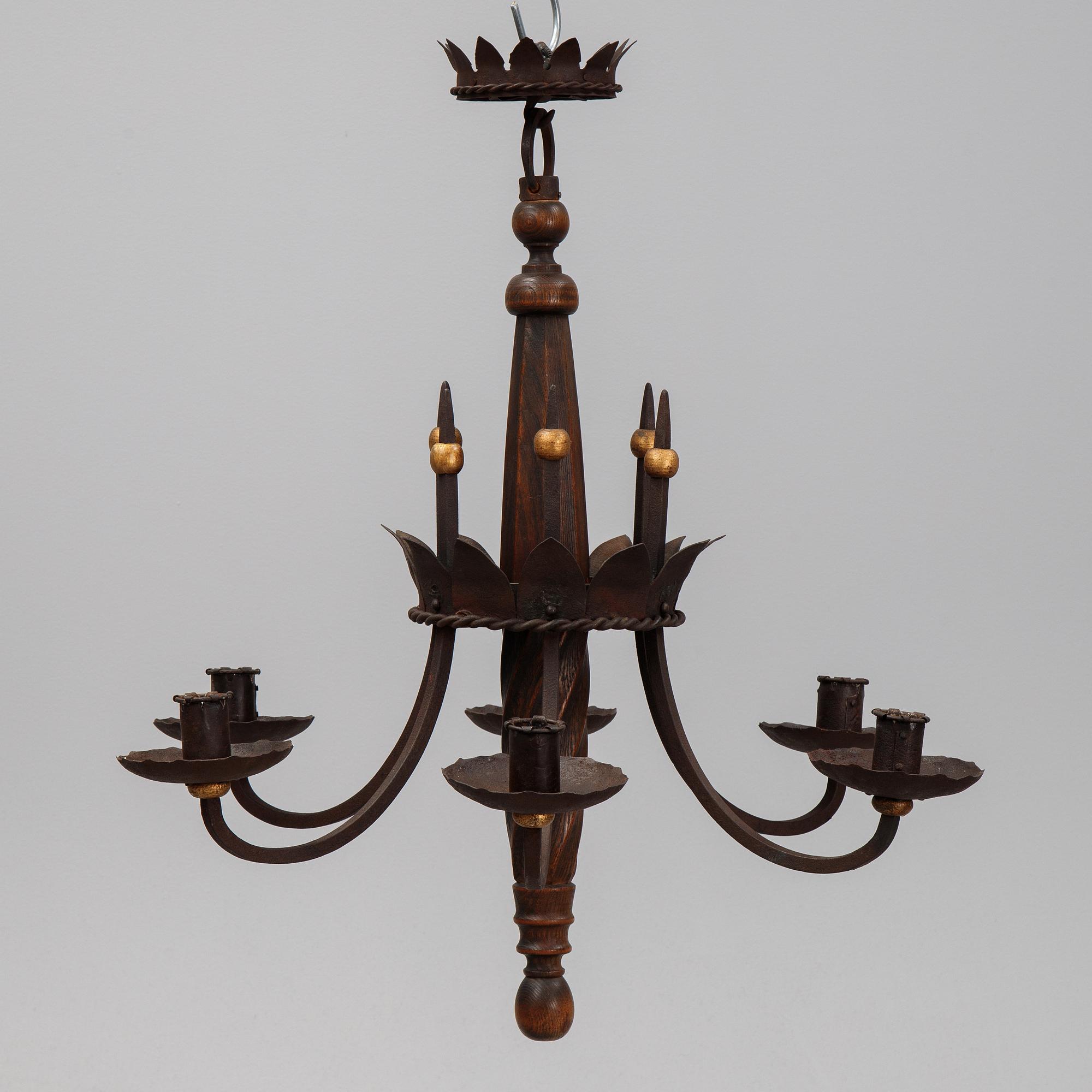 An iron and oak chandelier, 20th Century.