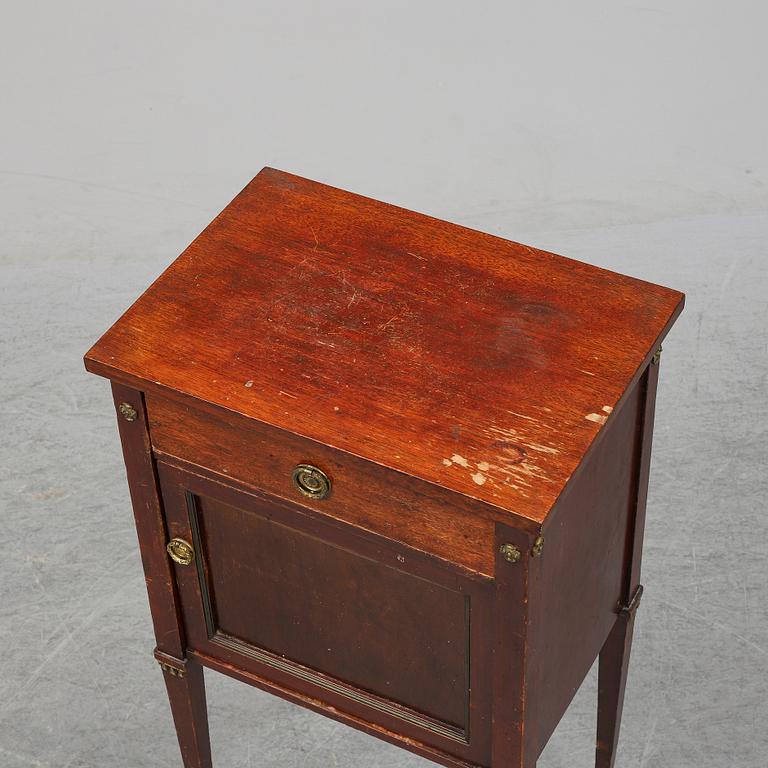 A first half of the 20th century mahogany veneered bedside table.