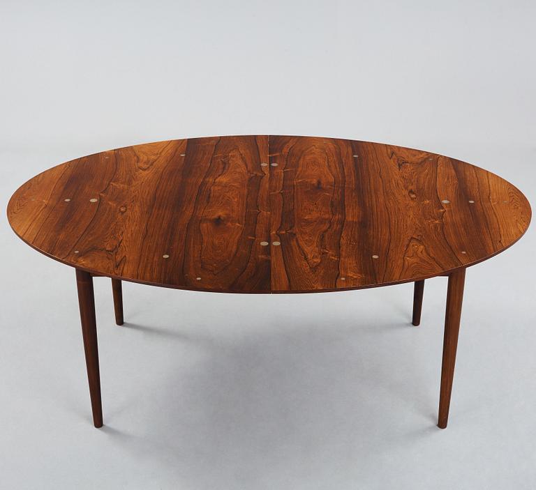 Finn Juhl, A Finn Juhl rosewood 'Judas' dining table, executed by Niels Vodder, Denmark 1960's.