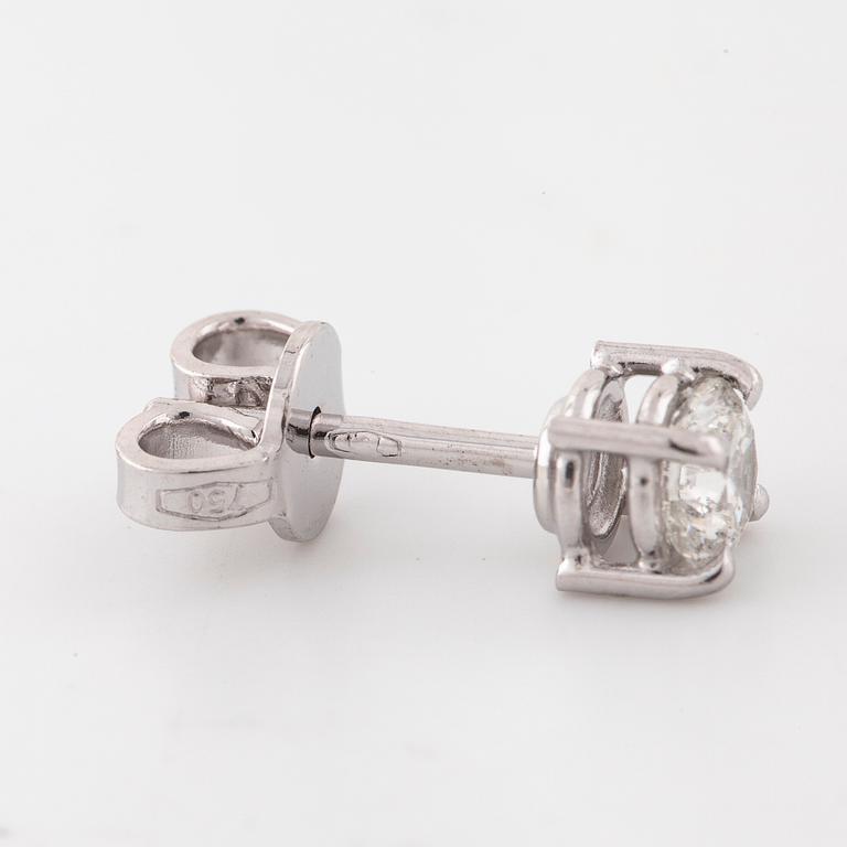 A pair of brilliant cut diamond earrings.