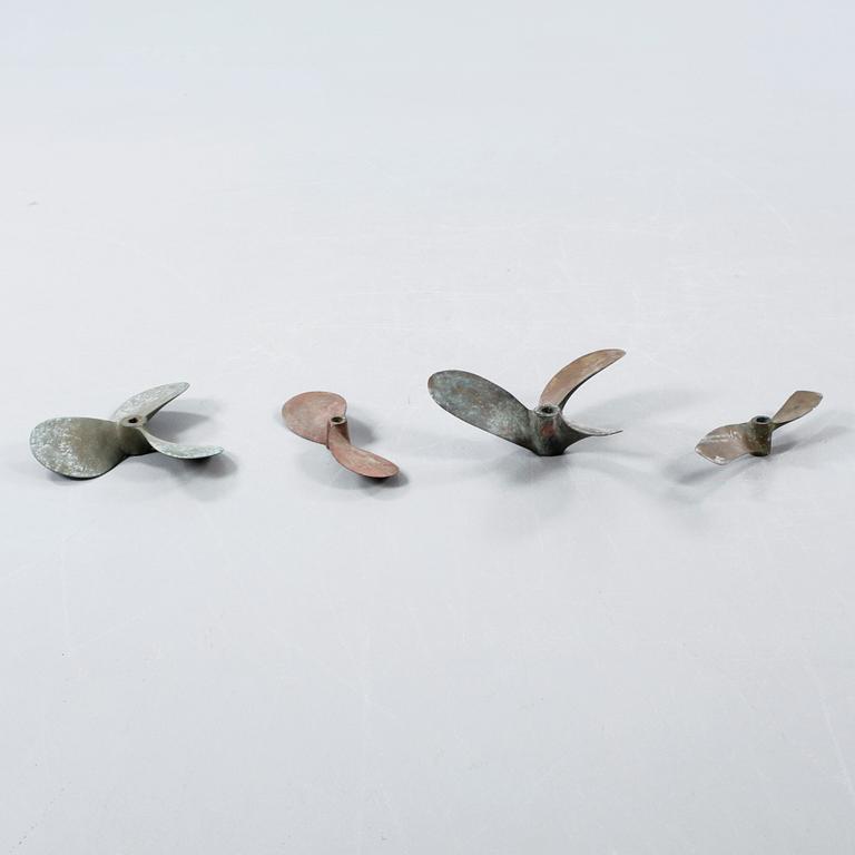 Four 20th century bronze propellers.