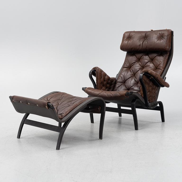 Bruno Mathsson, a 'Pernilla' armchair with ottoman, Dux, Sweden, second half of the 20th century.