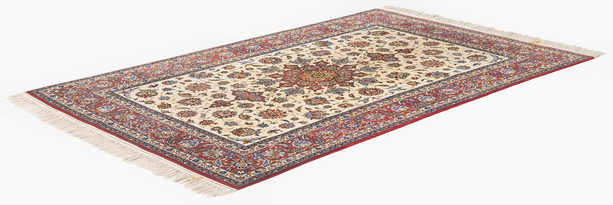 A semi-antique Isfahan rug, c. 225 x 143 cm.