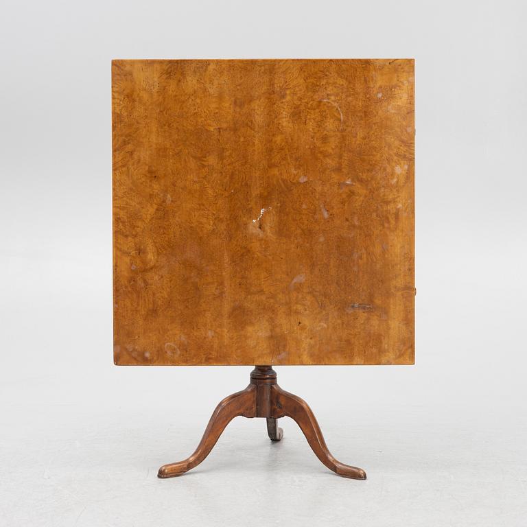A drop-leaf table, 19th Century.
