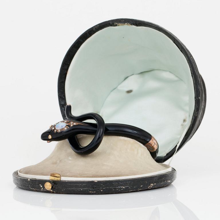 A Victorian snake bracelet in black enamel set with an opal and rose-cut diamonds.