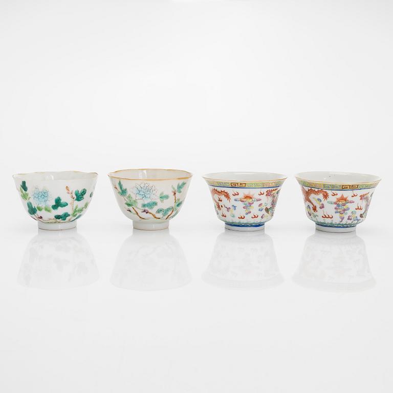 A set of seven bowls of which three with lids and a small famille rose jar, including Guangxu mark, China, circa 1900.