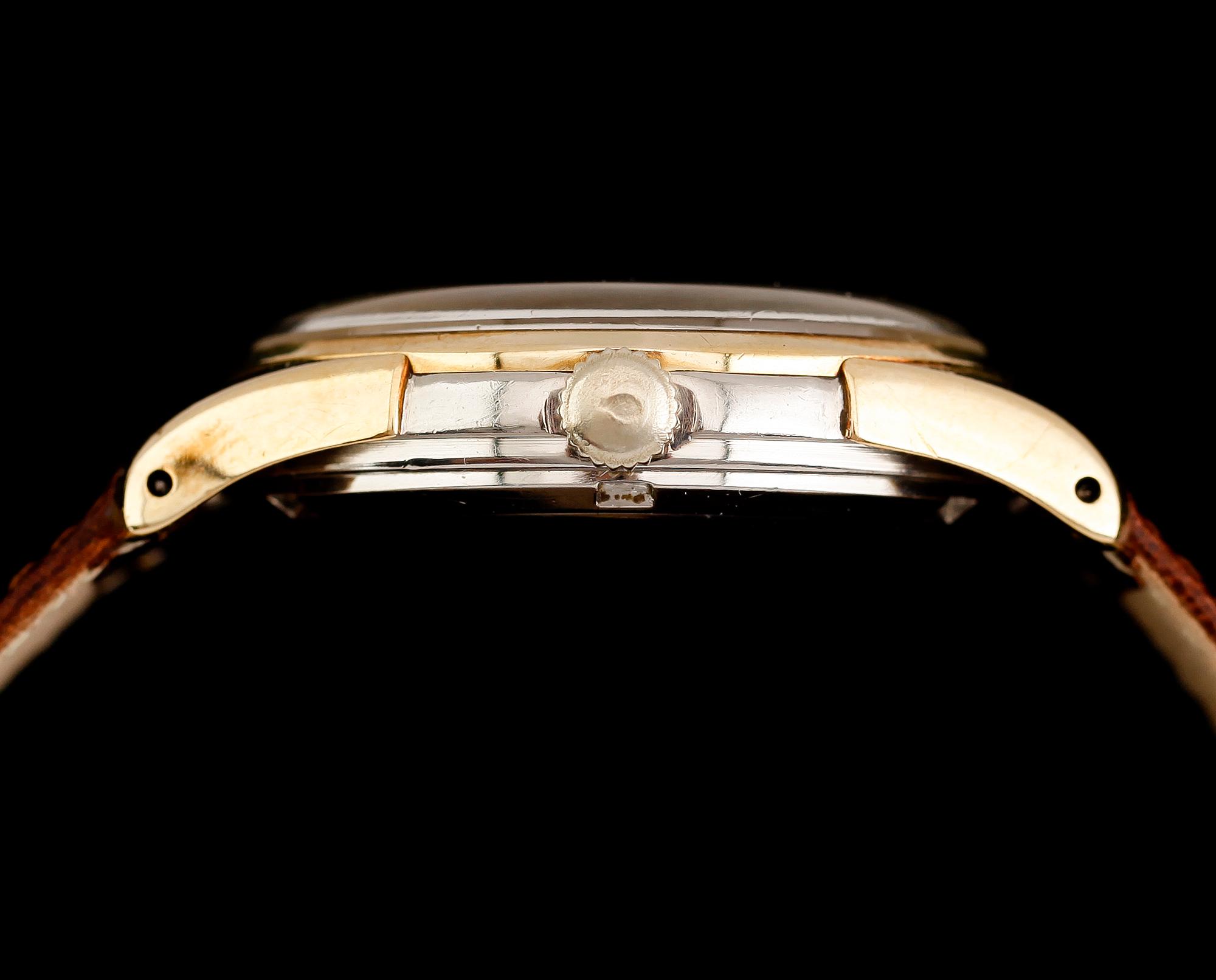 ARMBANDSUR, Omega, guld på stål, 1900-talets mitt.