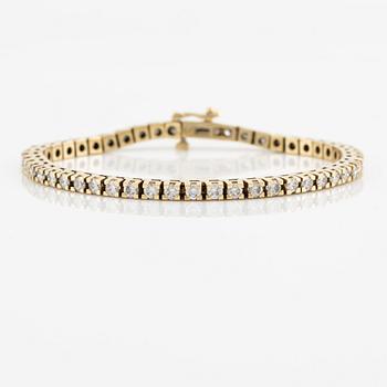 Tennisarmband, 18K guld med briljantslipade diamanter.