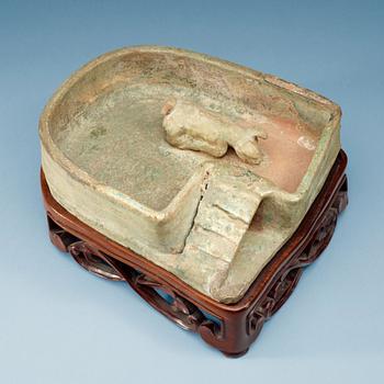 1400. A green glazed pottery model of a pig sty, Han dynasty  (206 BC–AD 220).