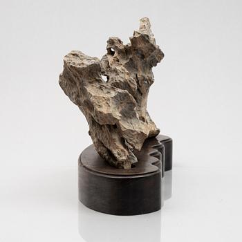 A Scholar's rock on hardwood stand, China, 20th century.