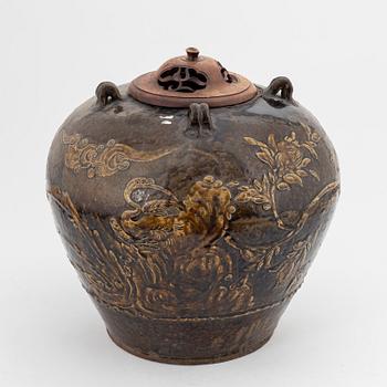 A large brown glazed marthaban jar, presumably late Ming dynasty (1368-1644).