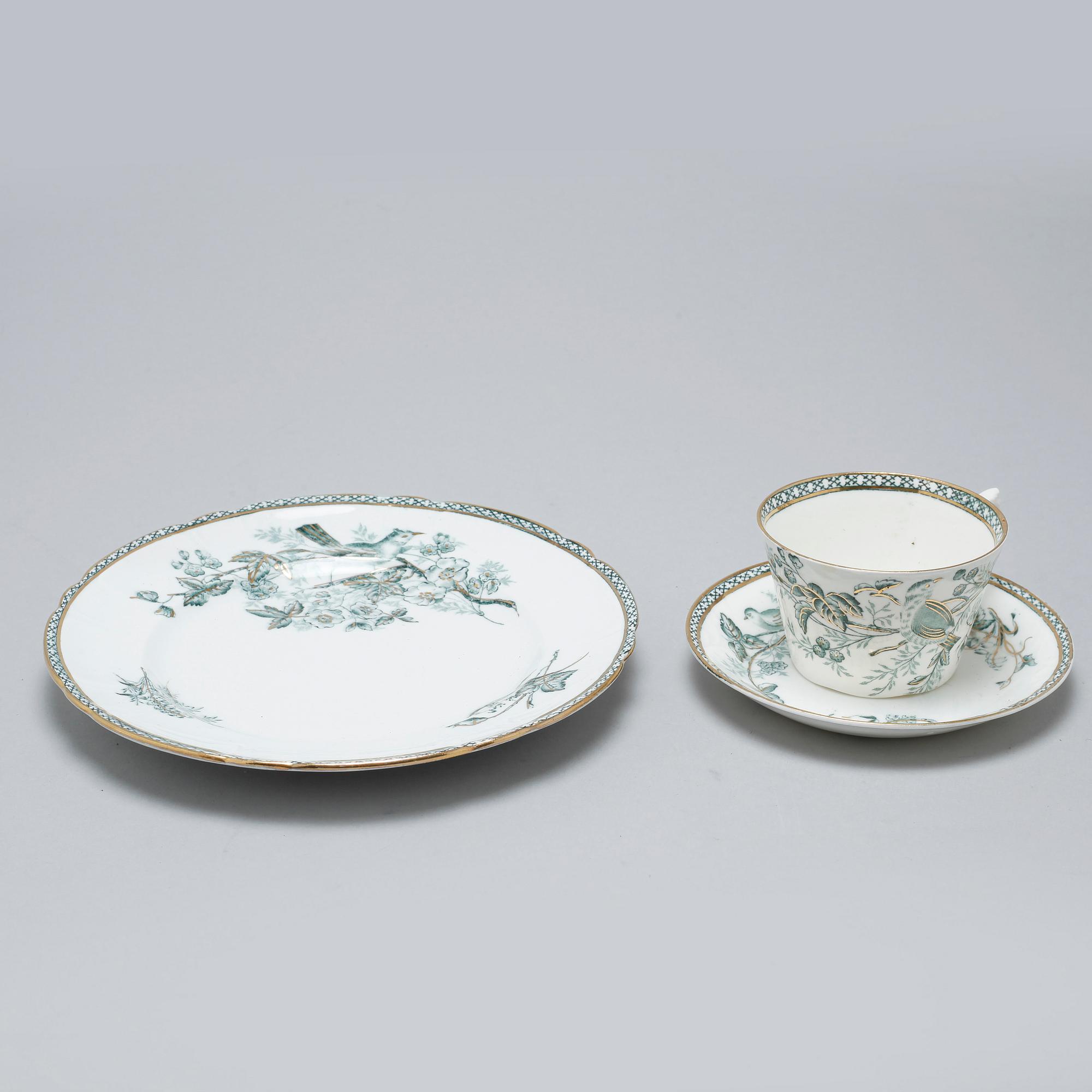 A earthenware table set of 136 pcs "Vexiö Guld",  by Arvid Ekberg, Gustafsberg, from around year 1900.
