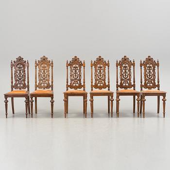 A set of six late 1800s chairs.