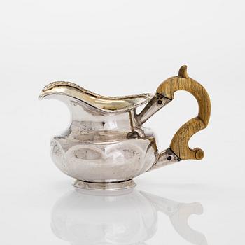 A silver ladle and cream jug,Johan Illberg, Viborg 1852, and unidentified master from Moscow, 1843.