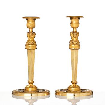 A pair of French Empire candlesticks, early 19th century.