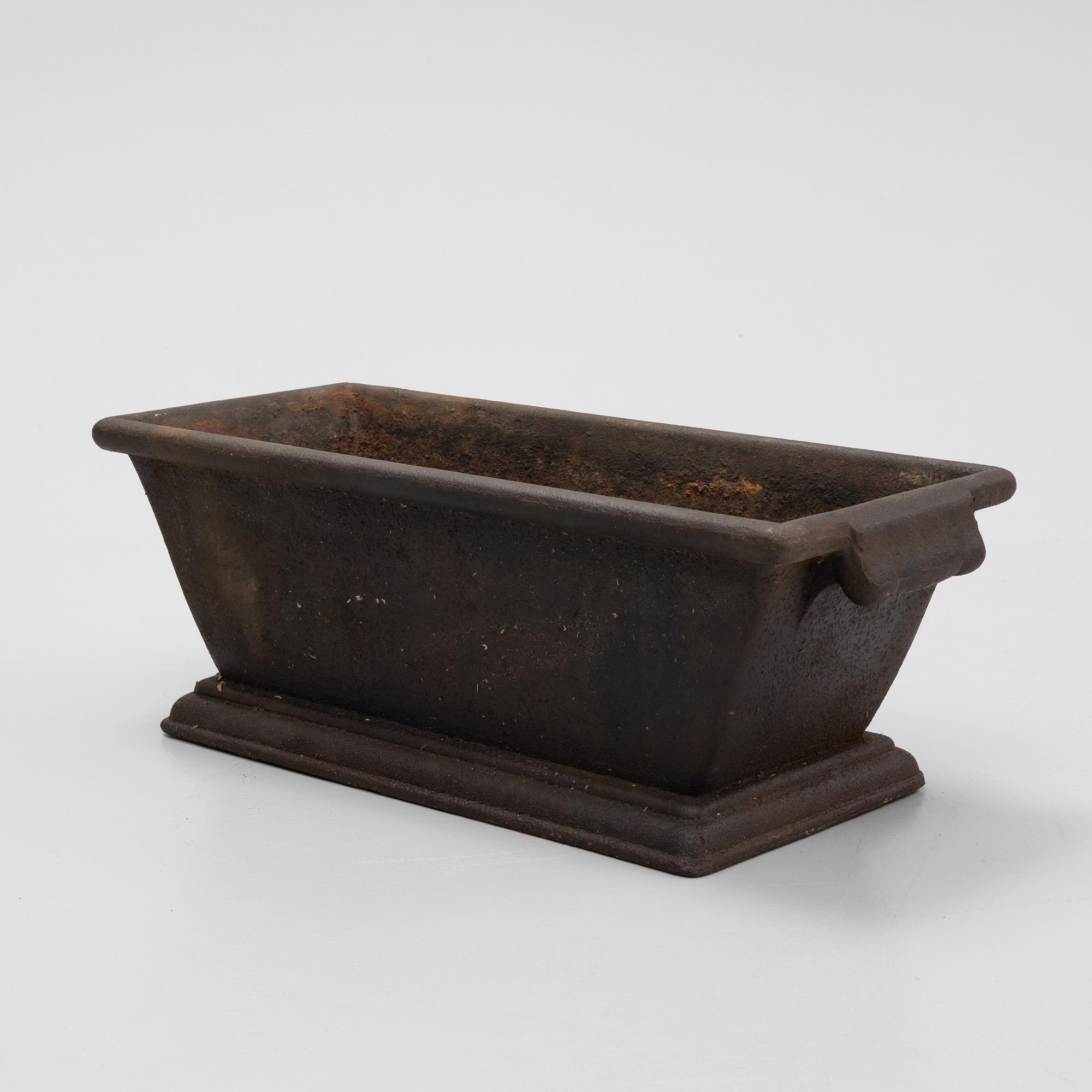A cast iron plant pot, 20th Century.