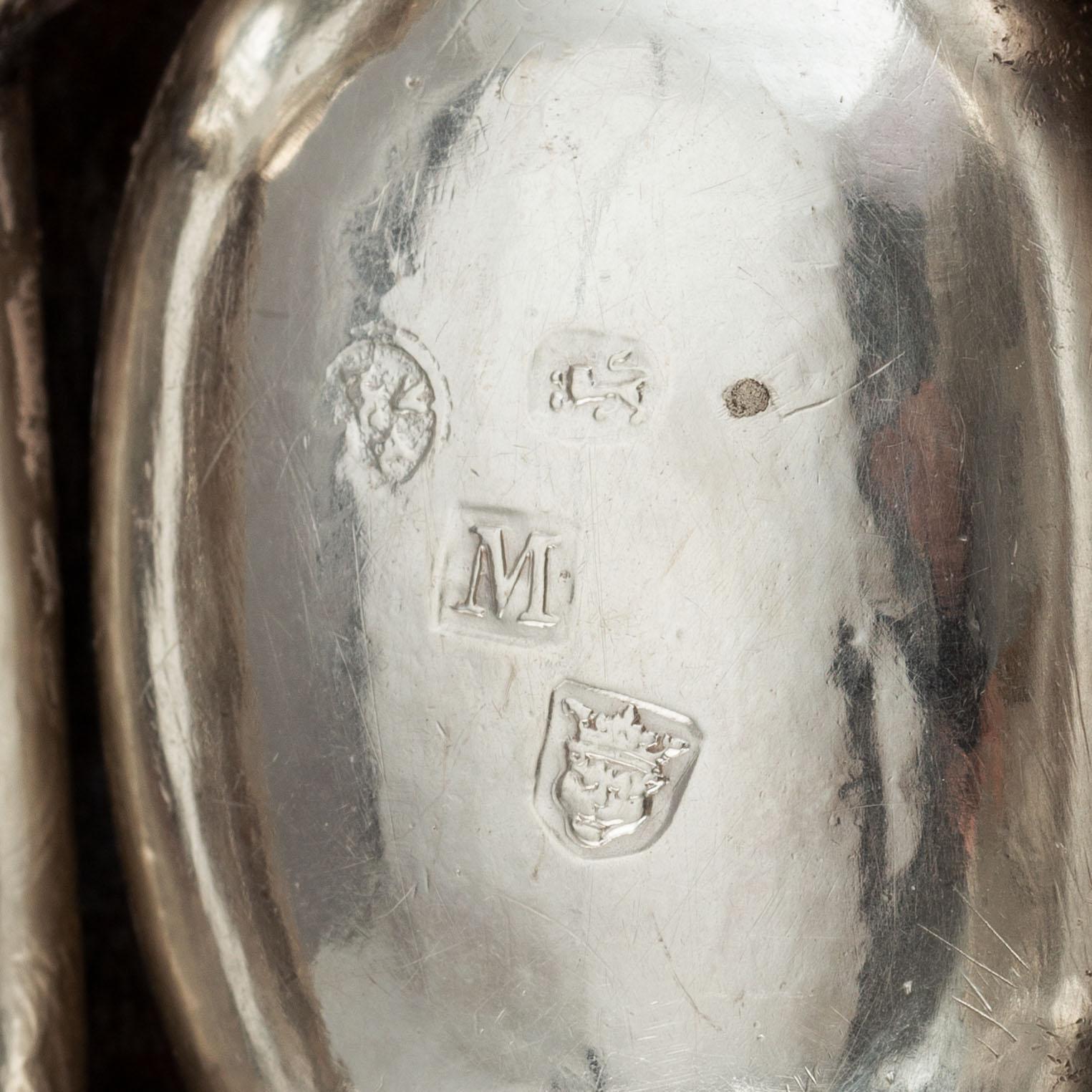 Four English early 18th century parcel-gilt silver salt-cellars, mark of Edward Wood, London 1727.