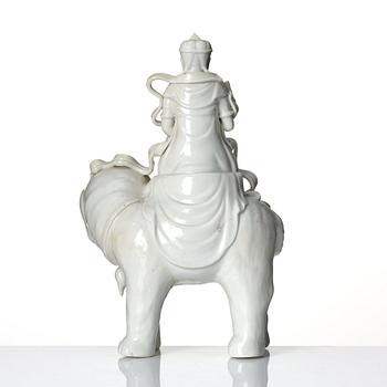 A large blanc-de-chine figure of Guanyin riding an elephant, late Qing dynasty/early 20th Century.