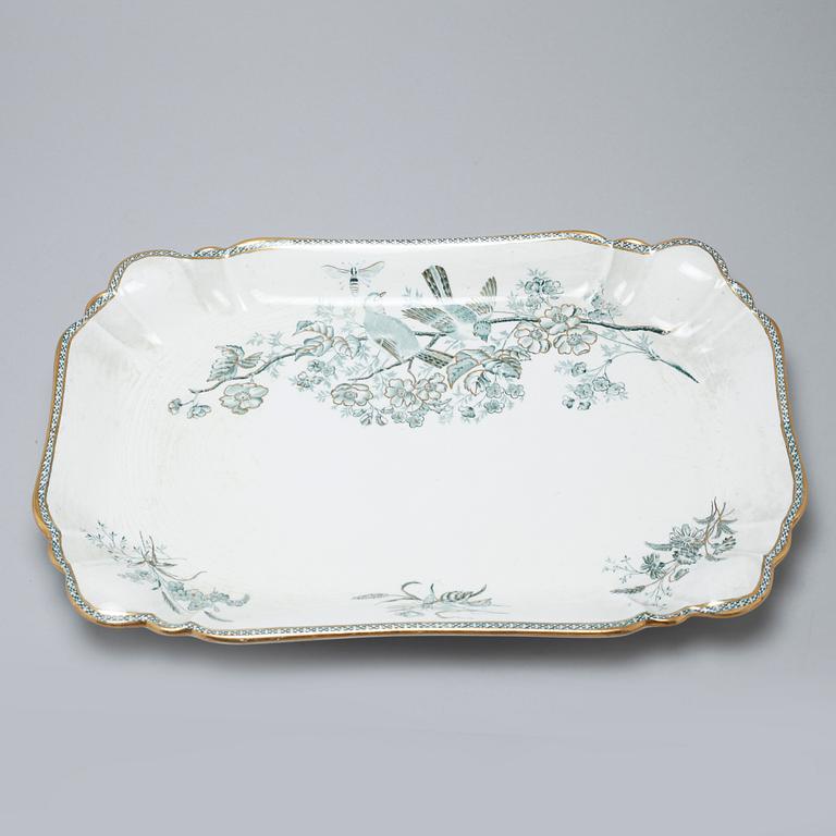 A earthenware table set of 136 pcs "Vexiö Guld",  by Arvid Ekberg, Gustafsberg, from around year 1900.