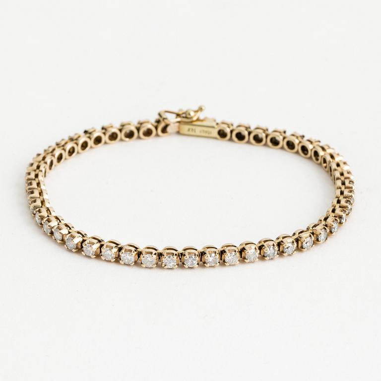 RIVIÈREARMBAND, 14K guld med 48 briljanter totalt ca 2.40 ct.