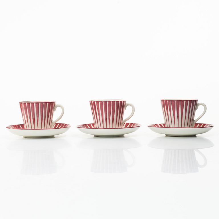Eugen Trost, Three 'Red Zebra' cream-ware coffee cups on saucers, Uppsala-Ekeby Gefle.