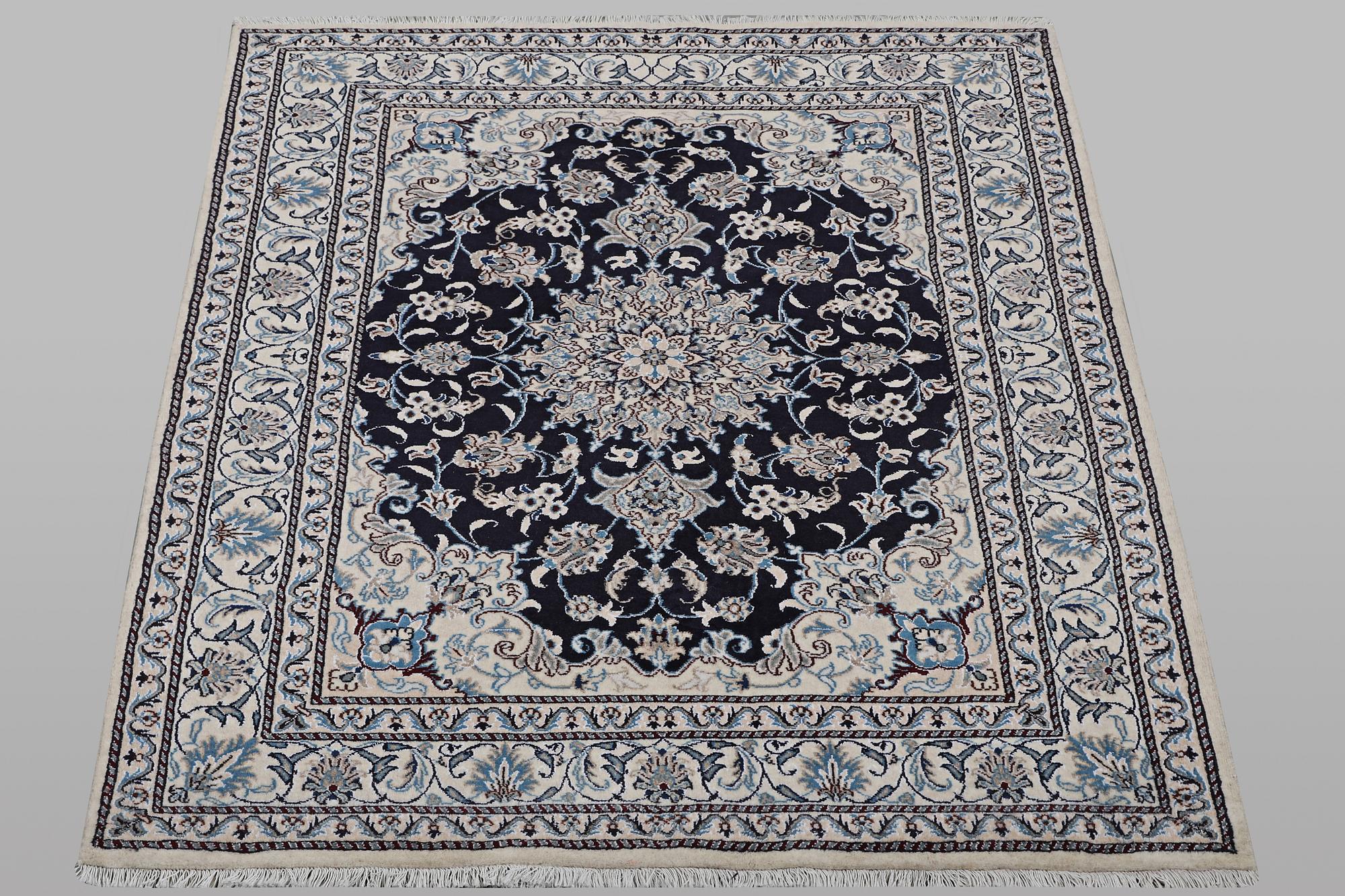 A rug, Nain, part silk, ca 198 x 144 cm.