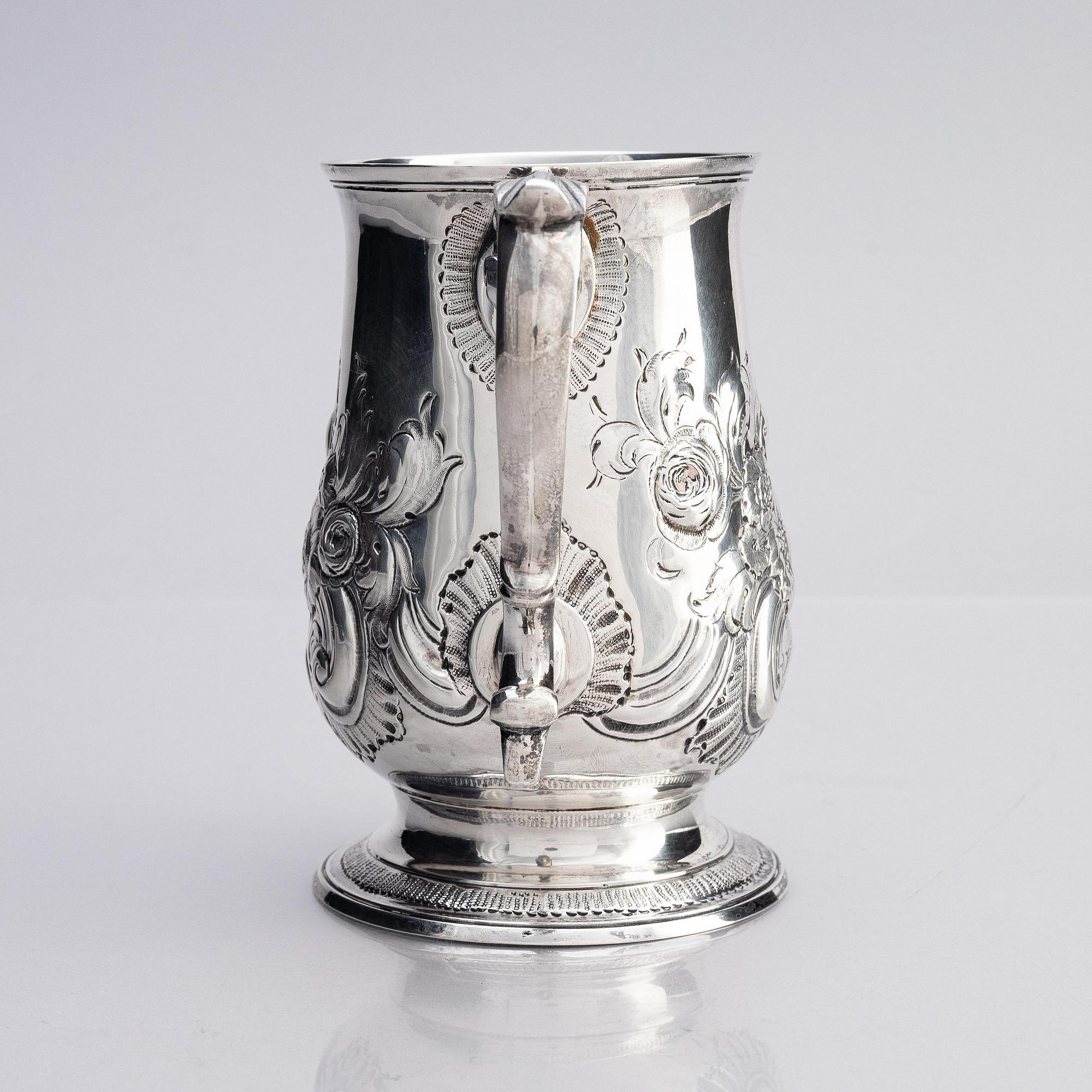 A silver mug, maker's mark probably Samuel Davenport, London 1794.
