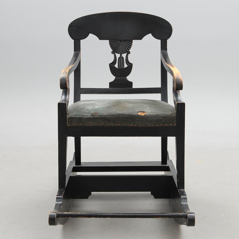 An empire style rocking chair from the end of the 19th Century.