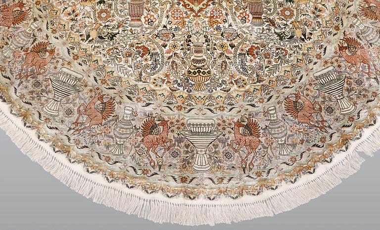 An oval pictoral silk carpet, ca 273 x 180 cm.