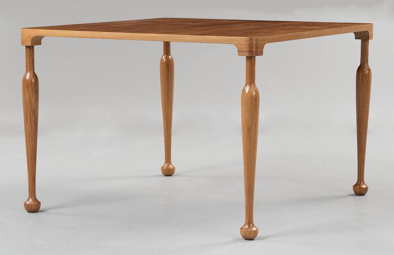 A Josef Frank walnut top sofa table, Svenskt Tenn, model 2181.
