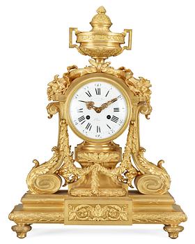 555. A Louis XVI-style late 19th Century gilt bronze mantel clock.