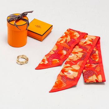 HERMÈS, a 'Twilly' silk scarf and metal scarf ring.