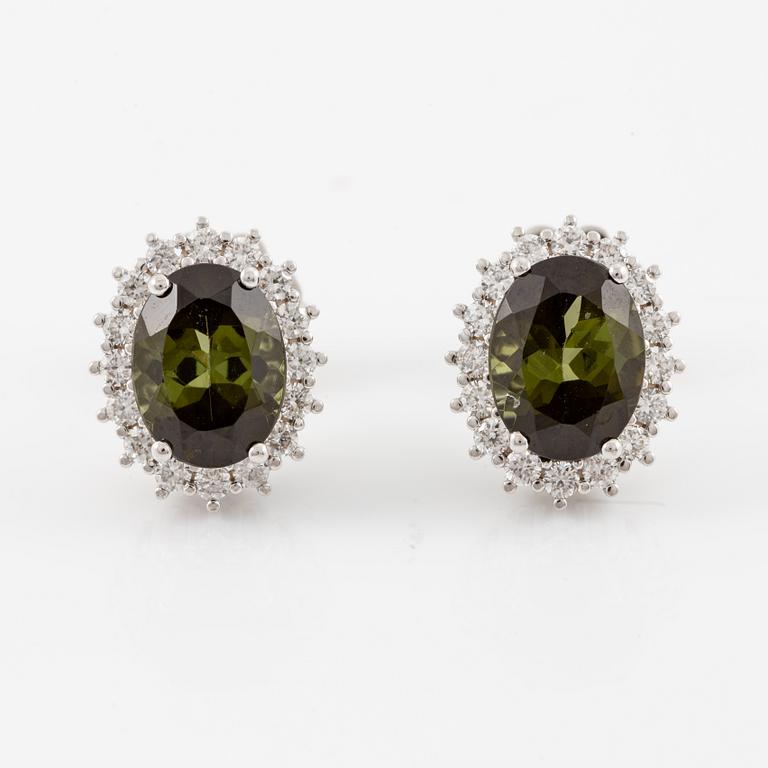 Earrings with green tourmalines and brilliant-cut diamonds.