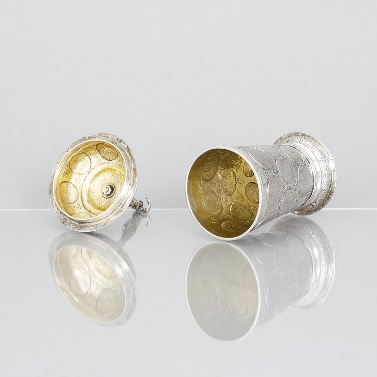 An 19th century parcel-gilt silver cup with lid, unidentified makers mark, probably Nürnberg.