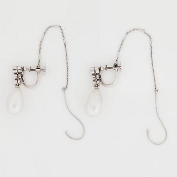 A pair of natural drop-shaped saltwater pearl and old-cut diamond earrings. Length of pearls circa 14 - 14.5 mm.