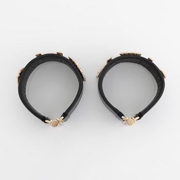 Chanel, a pair of black leather and rhinestone bracelets.