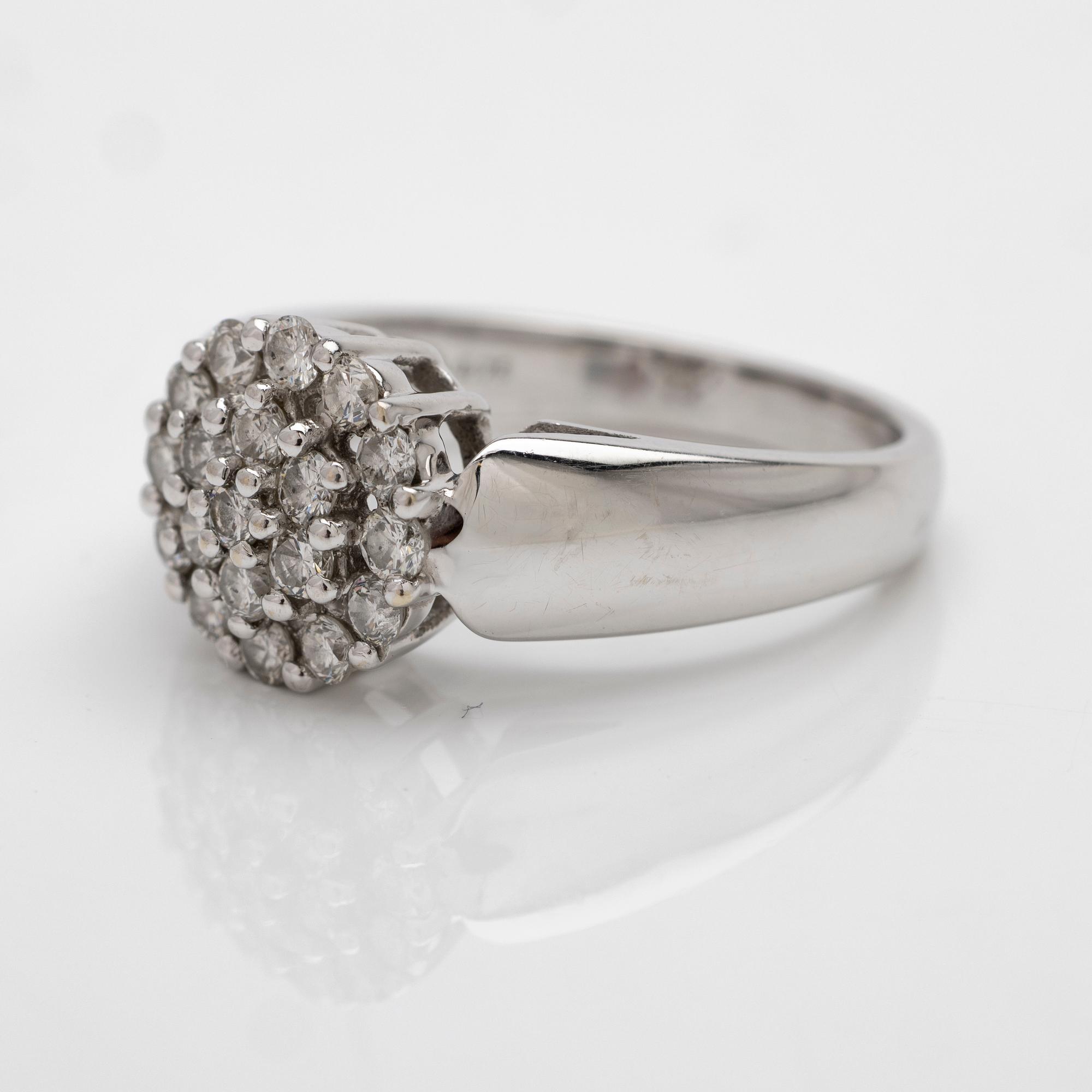 18K white gold ring with diamonds.