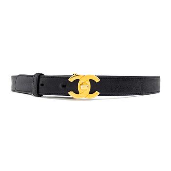 A black leather belt by Chanel.