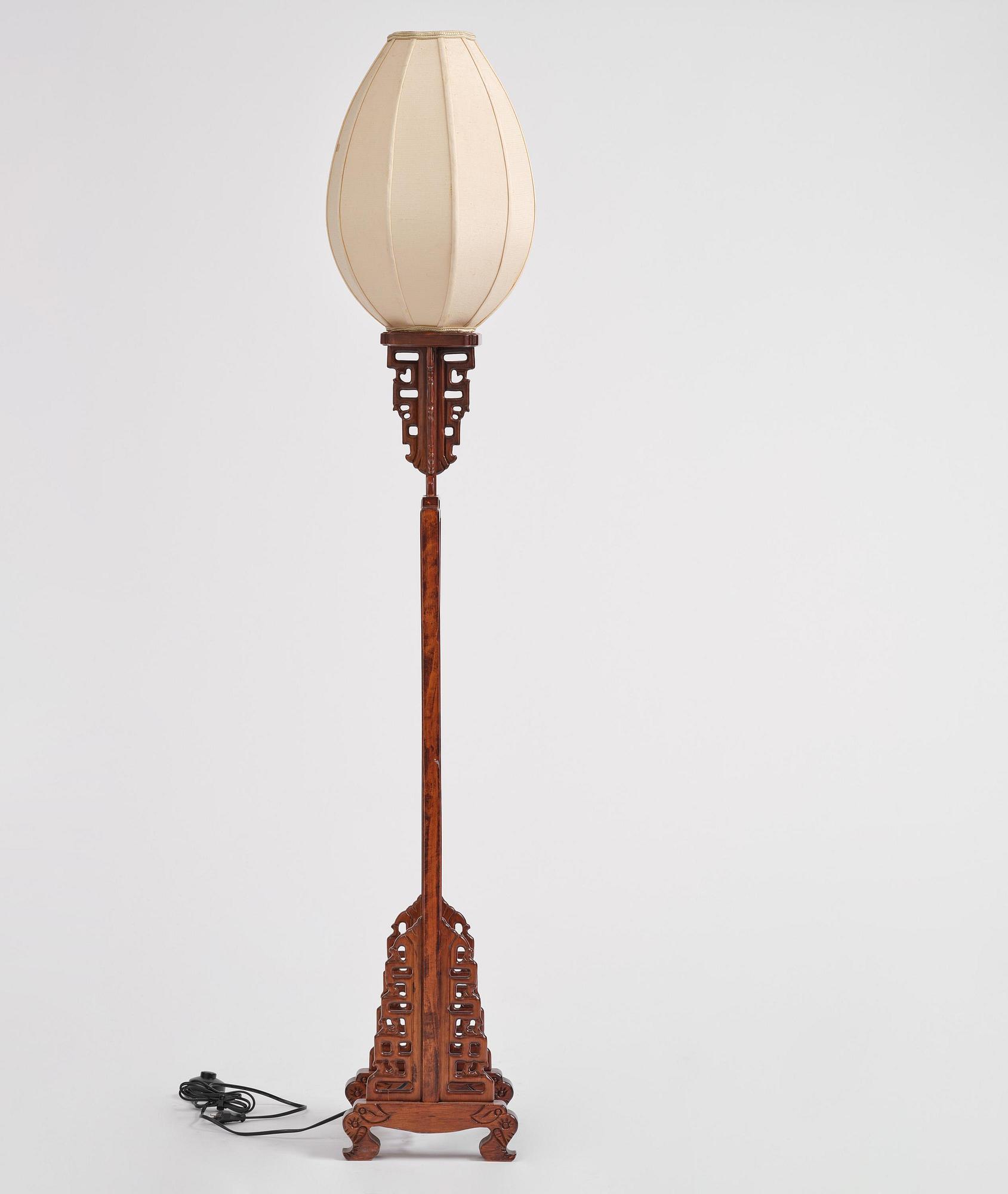 A Chinese wooden floor lamp, later part of the 20th century.