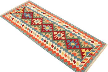 An Afghan kilim runner, c. 200 x 80 cm.