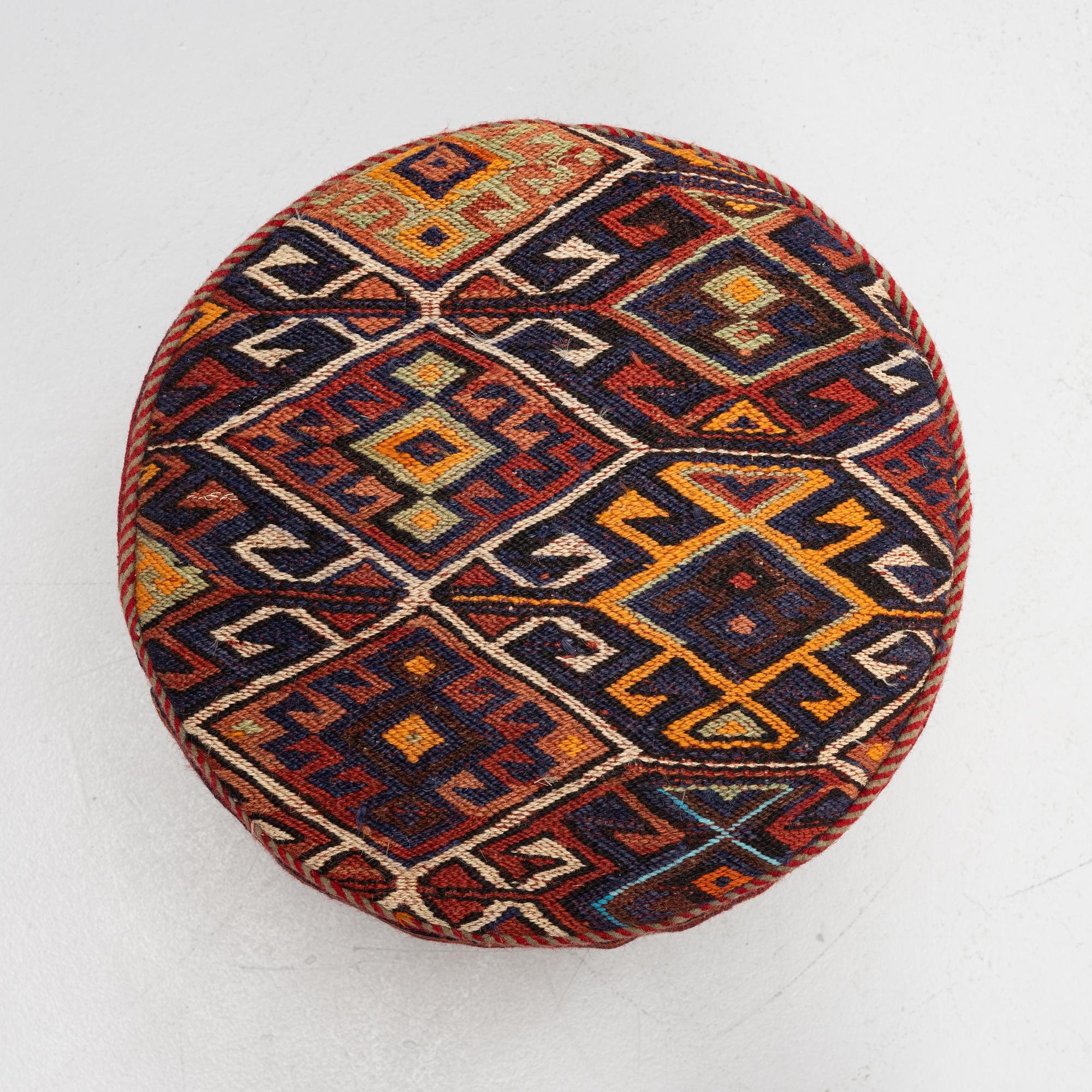 A Kelim covered stool.