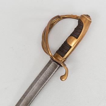 An 19th Century curved officer's sword with etched blade and steel scabbard.