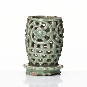 A reticulated lonquan celadon vase/candle holder, Ming dynasty (1368-1644).