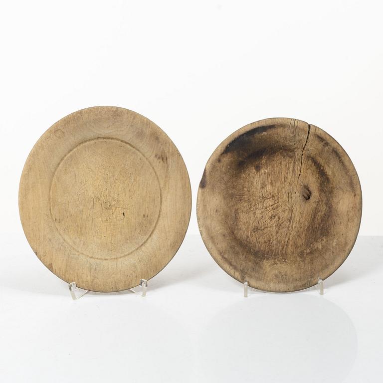 Twelve wooden plates, 19th Century.