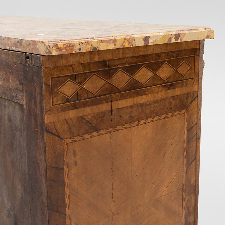 A Louis XVI-style marquetry and marble commode, later part of the 19th century.